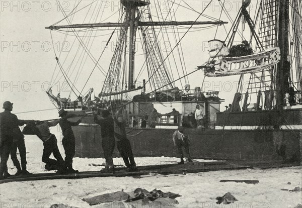 'Landing a Motor-Sledge', c1910?1913, (1913). Artist: Herbert Ponting.