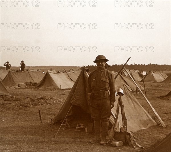 Soldier standing by tent, American camp, Melette, France, c1914-c1918. Artist: Unknown.