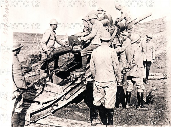 Loading shell into 155 mm gun, c1914-c1918. Artist: Unknown.