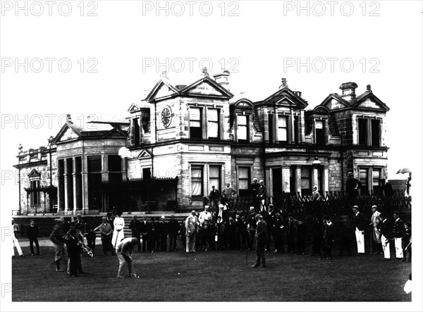 Old Tom Morris outside the Old Course Clubhouse at St Andrews in Scotland, c1900. Artist: Unknown.