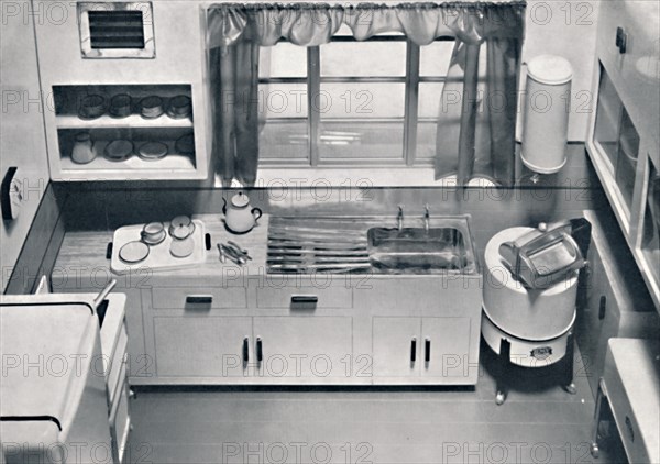 'View of a kitchen, designed by H.M.V. Household Appliances', 1938. Artist: Unknown.