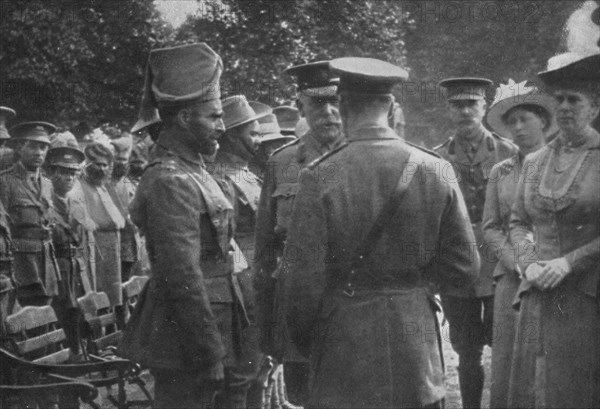 'H.M. King George V Talking To Sir Walter Lawrence and Mir Dast, V.C., 25th August 1915', (1939). Artist: Unknown.