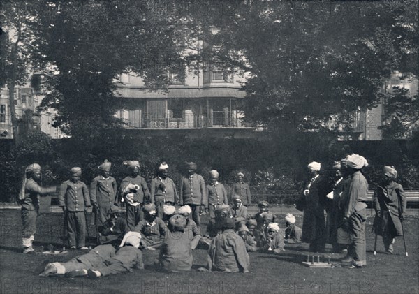 'Convalescent Indian Soldiers Playing Quoits on the Eastern Lawns', c1915, (1939). Artist: Unknown.