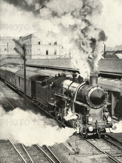 'Leaving Budapest. An express train departs from the Central Station', 1935-36. Creator: Unknown.