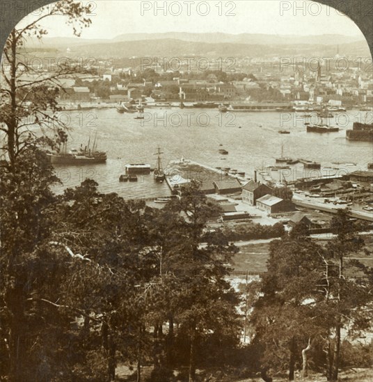 'Christiania and her busy harbor, N.W. from the Ekeberg (Royal Palace at right), Norway', c1905. Creator: Unknown.