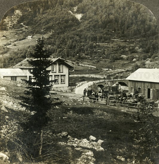 'On the picturesque Telemarken road - changing horses at Grundesbro skyds station, Norway', c1905. Creator: Unknown.