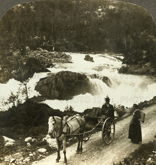 'Halt of a stolkjaerre on the Telemarken road beside the foaming Little Rjukan Falls, Norway', c1905 Creator: Unknown.