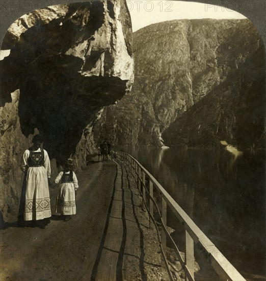 'Narrow rock-shelf where the road to Voring Falls past Lake Oifjord's deep waters, Norway', c1905. Creator: Unknown.
