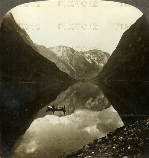 'Looking down the deep, still Naerofjord, from near Gudvangen, Norway', c1905. Creator: Unknown.