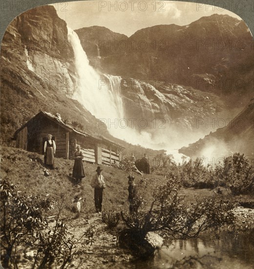 'Humble mountain home at the foot of cliffs where Skiaeggedals Falls leap 525 ft., Norrway', c1905. Creator: Unknown.