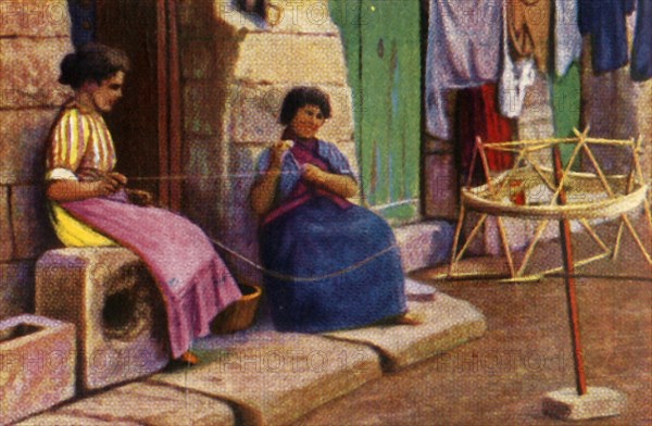 Fisherwomen winding yarn for nets, Malta, c1928. Creator: Unknown.