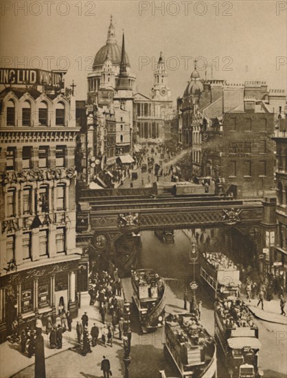 'Spire of St. Martin's Ludgate Silhouetted Against The Bulk of St. Paul's', c1935. Creator: Unknown.