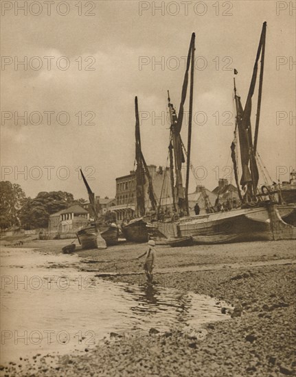 'Barges Aground At Mortlake With The Tide at Full Ebb', c1935. Creator: Donald McLeish.