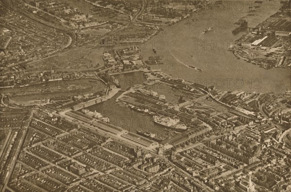 'The Three Basins of the East India Docks and the Blackwall Reach of the Thames Seen From The Air',  Creator: Aerofilms.