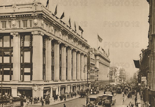 'Selfridge's and the last of the old Oxford Street shops that the building engulfed', c1935. Creator: Unknown.