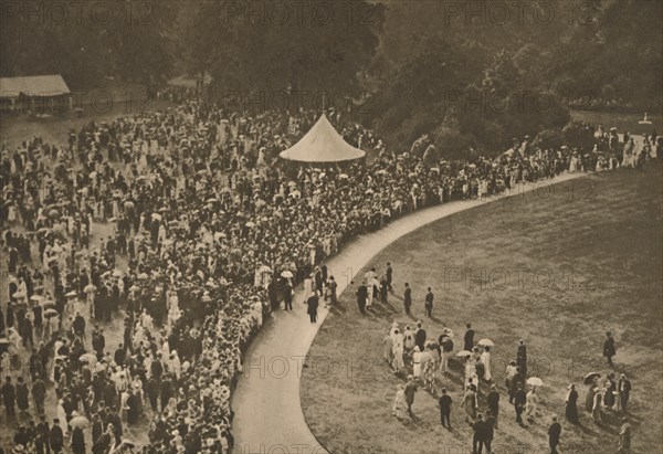 'A Glimpse of One of the Annual Royal Garden Parties Among The Timbered Lawns of Buckingham Palace', Creator: Unknown.