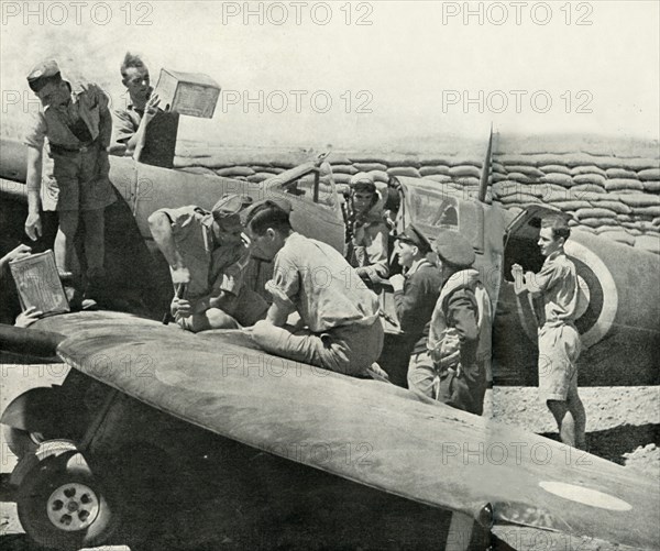 Refuelling and re-arming Spitfire fighters, Malta, World War II, 1942 (1944). Creator: Unknown.