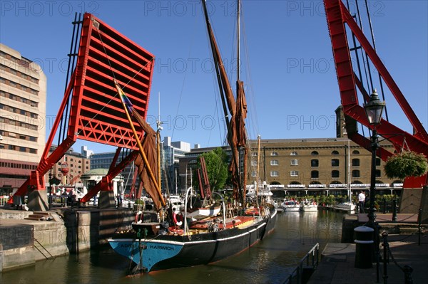 Barge passing through St Katherine's Lock, London