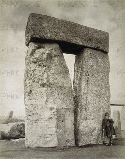 A shepherd posing at Stonehenge on Salisbury Plain, Wiltshire, 19th century. Artist: Unknown