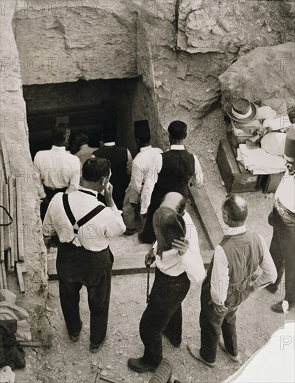 A party going down the steps to the tomb of Tutankhamun, Valley of the Kings, Egypt, 1923. Artist: Harry Burton