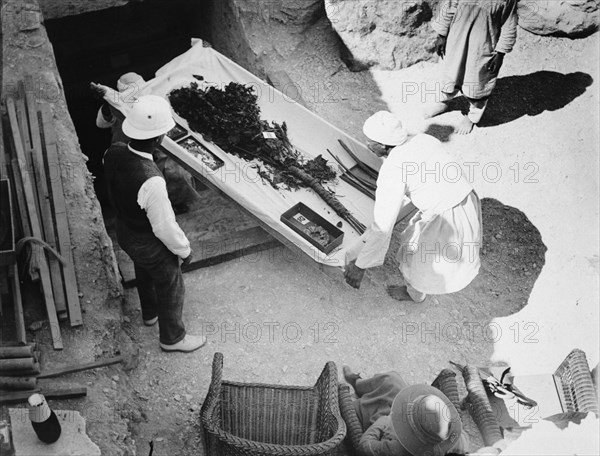 Funeral bouquet being removed from the tomb of Tutankhamun, Valley of the Kings, Egyp, 1922. Artist: Harry Burton