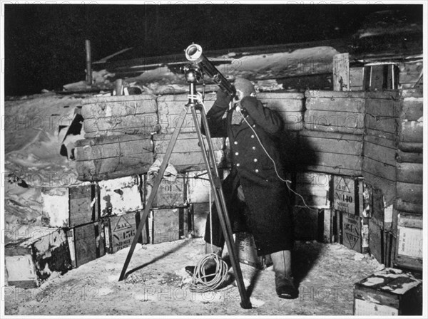 'Commander Evans observing an Occulation of Jupiter', Antarctica, 1910-1912. Artist: Herbert Ponting