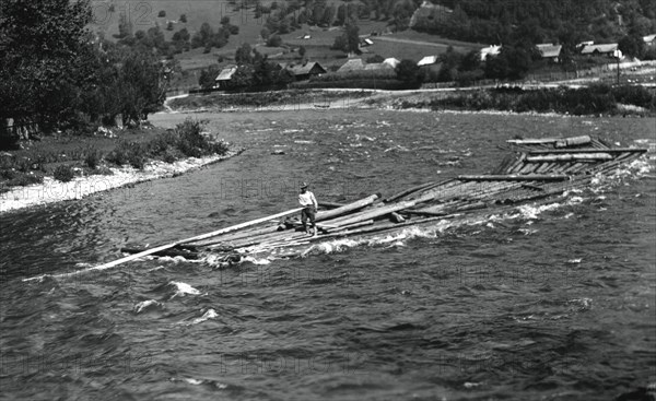 Floating tree trunks down the river, Bistrita Valley, Moldavia, north-east Romania, c1920-c1945. Artist: Adolph Chevalier