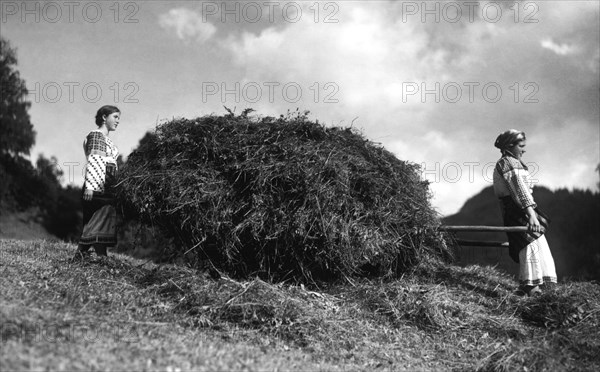 Bringing in the harvest, Bistrita Valley, Moldavia, north-east Romania, c1920-c1945. Artist: Adolph Chevalier