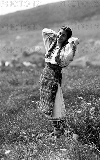 Young woman in traditional costume, Bistrita Valley, Moldavia, north-east Romania, c1920-c1945. Artist: Adolph Chevalier