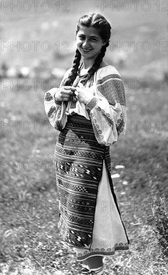 Young woman in traditional costume, Bistrita Valley, Moldavia, north-east Romania, c1920-c1945. Artist: Adolph Chevalier