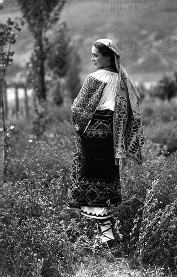 Young woman in traditional costume, Bistrita Valley, Moldavia, north-east Romania, c1920-c1945. Artist: Adolph Chevalier