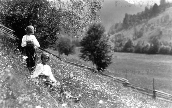 Two girls in a meadow, Bistrita Valley, Moldavia, north-east Romania, c1920-c1945. Artist: Adolph Chevalier