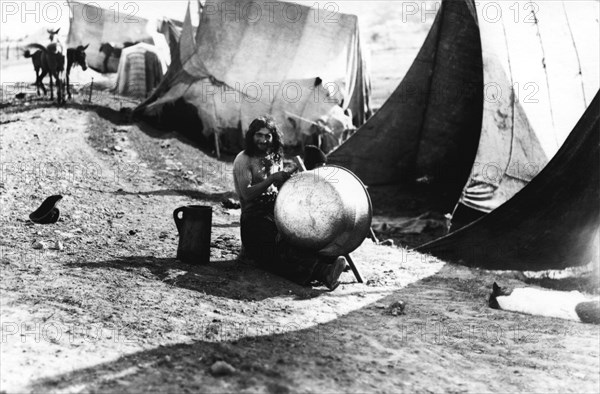 Man with a large pot, Bistrita Valley, Moldavia, north-east Romania, c1920-c1945. Artist: Adolph Chevalier