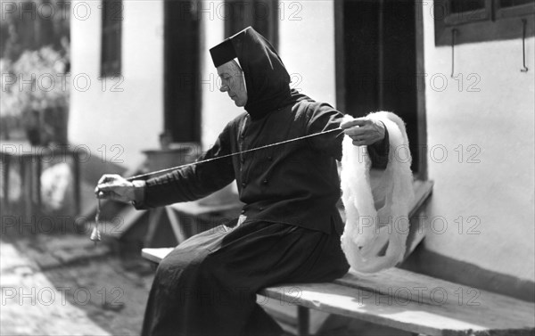 Woman spinning, Bistrita Valley, Moldavia, north-east Romania, c1920-c1945. Artist: Adolph Chevalier