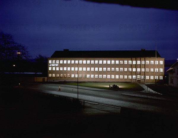 Exterior of an engineering industry building at night, Jönköping, Sweden, 1954. Artist: Göran Algård