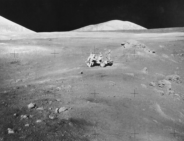 Lunarscape of Station 4, showing Harrison Schmitt at the lunar roving vehicle, 1972.  Creator: Unknown.
