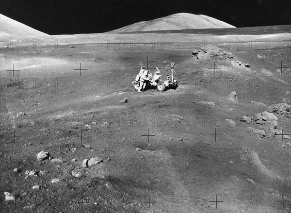 Lunarscape of Station 4, showing Harrison Schmitt at the lunar roving vehicle, 1972.  Creator: Unknown.