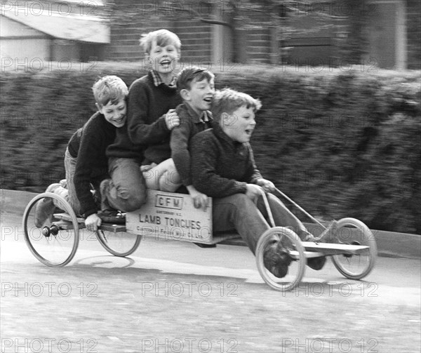 Boys playing with a home-made go-kart, Horley, Surrey, 1965.