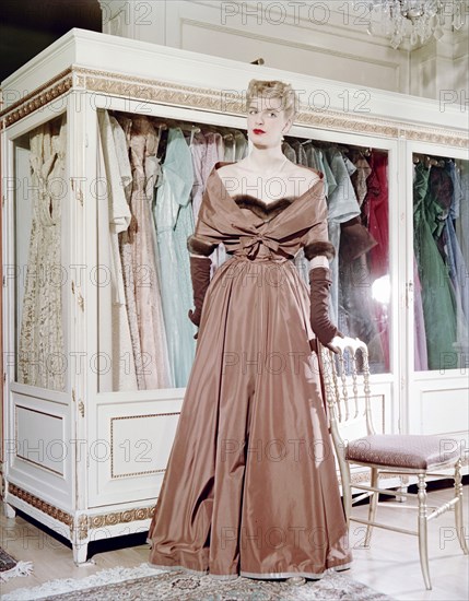 Female model shows an evening dress, Stockholm, 1950s. Artist: Göran Algård