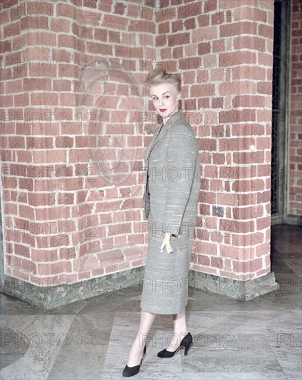 Female model shows a suit, the Historical Museum, Stockholm, 1950s. Artist: Göran Algård