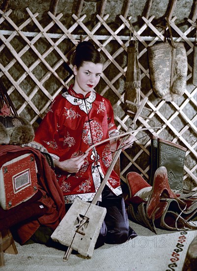 Model showing an evening jacket in oriental style, 1950s.  Artist: Göran Algård