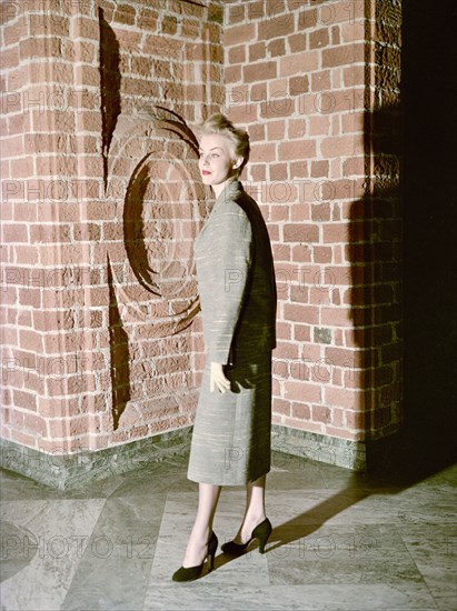 Female model shows a suit, the Historical Museum, Stockholm, 1950s. Artist: Göran Algård