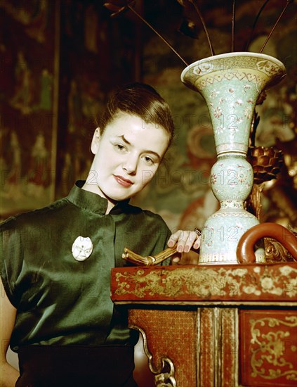 Model wearing an evening dress in oriental style, 1950s.  Artist: Göran Algård