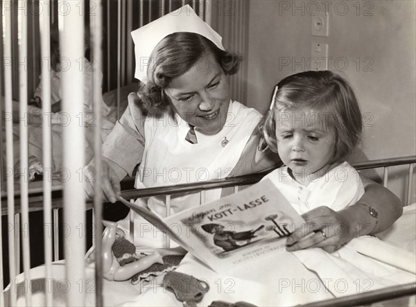 Nurse and her young patient at a children's hospital, Stockholm, Sweden, 1940s. Artist: Karl Sandels