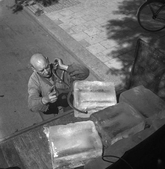 Iceman busy during the heatwave in Stockholm, Sweden, 24th July 1943. Artist: Karl Sandels