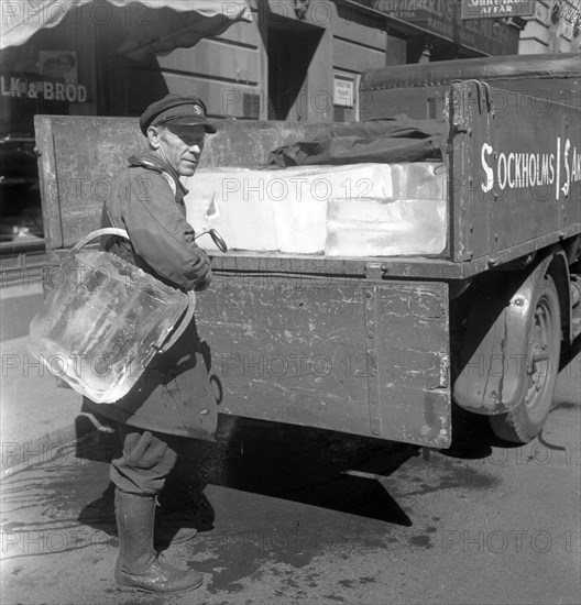 Iceman busy during the heatwave in Stockholm, Sweden, 24th July 1943. Artist: Karl Sandels