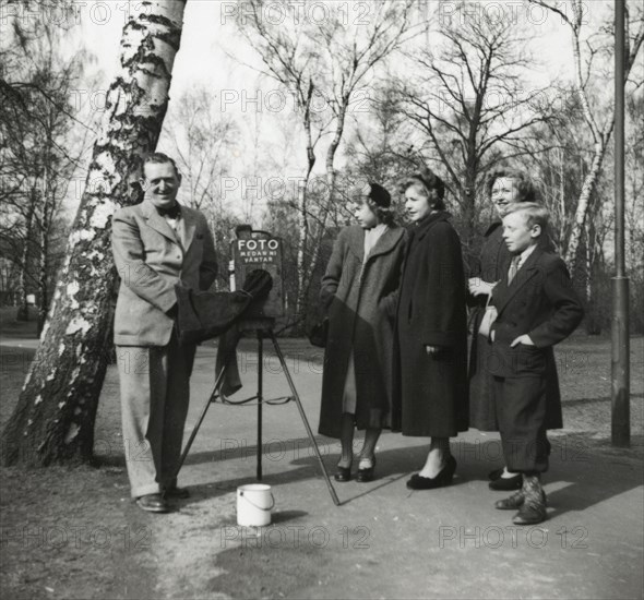 A photographer in a park, Landskrona, Sweden 1952. Artist: Unknown