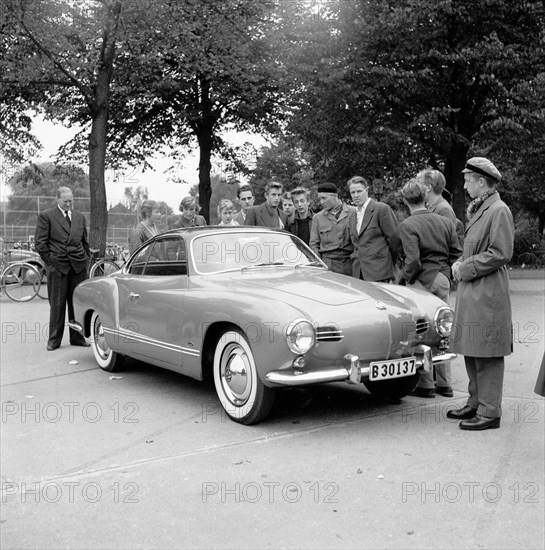 Young men admire the new Volkswagen Karmann Ghia, Landskrona, Sweden, 1955. Artist: Unknown