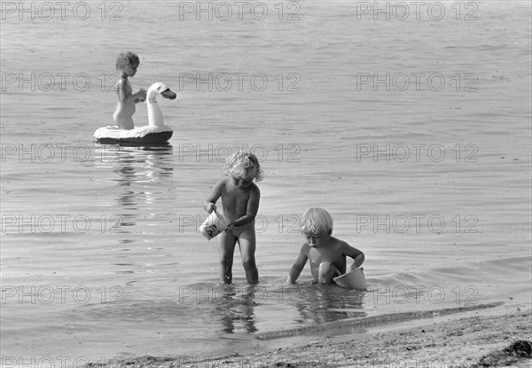 Children bathing in the Öresund, Bostahusen, Landskrona, Sweden 1966. Artist: Unknown