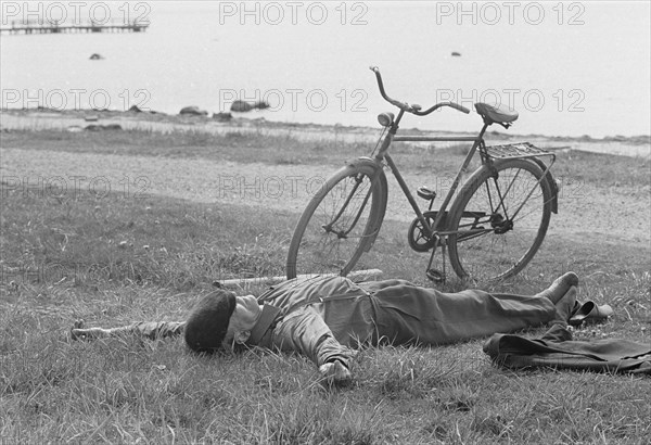 A nap by the sea at Borstahusen, Landskrona, Sweden, 1967. Artist: Unknown